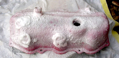 Applying paint stripper to valve cover